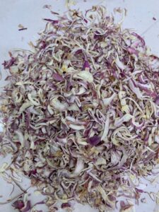 Premium Dehydrated Pink Onion Flakes manufacturer, exporter and supplier from India by Flouers Agri Pvt Ltd