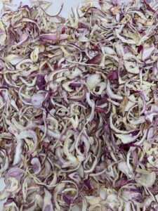 Premium Dehydrated Pink Onion Flakes manufacturer, exporter and supplier from India by Flouers Agri Pvt Ltd